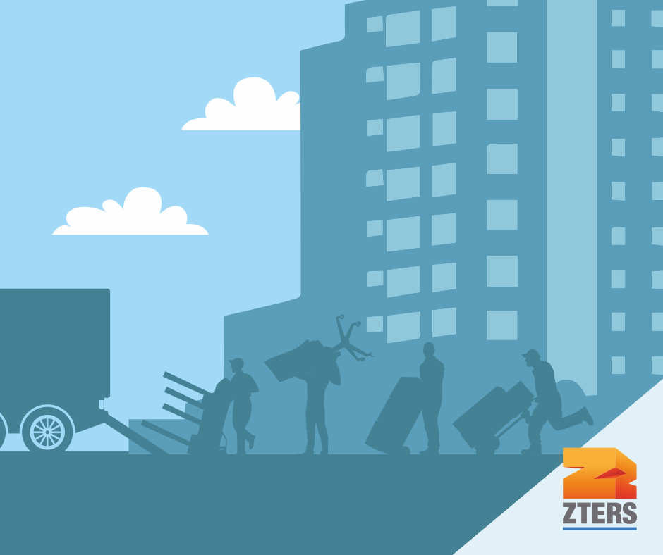 Office junk removal depicted by a line of people holding furniture including a chair and table, hauling it into the back of a truck. A tall building and clouds are behind them. ZTERS logo is in bottom right.