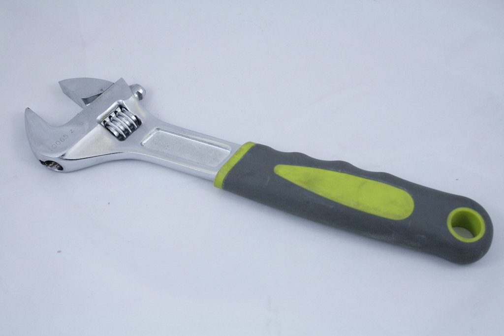 A picture of a adjustable wrench.