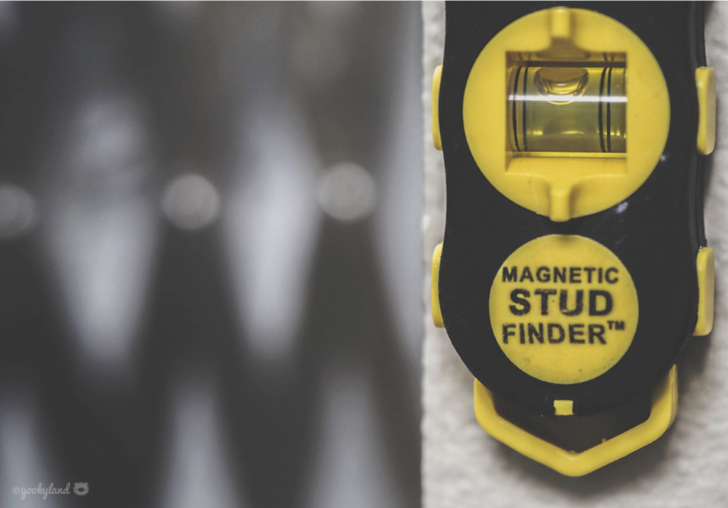 A picture of a magnetic stud finder tool.