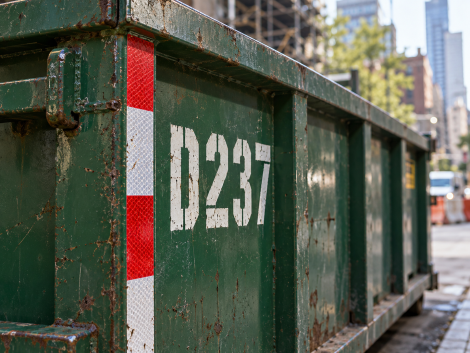 Reflective corner marking and identification lettering required on a permitted construction dumpster